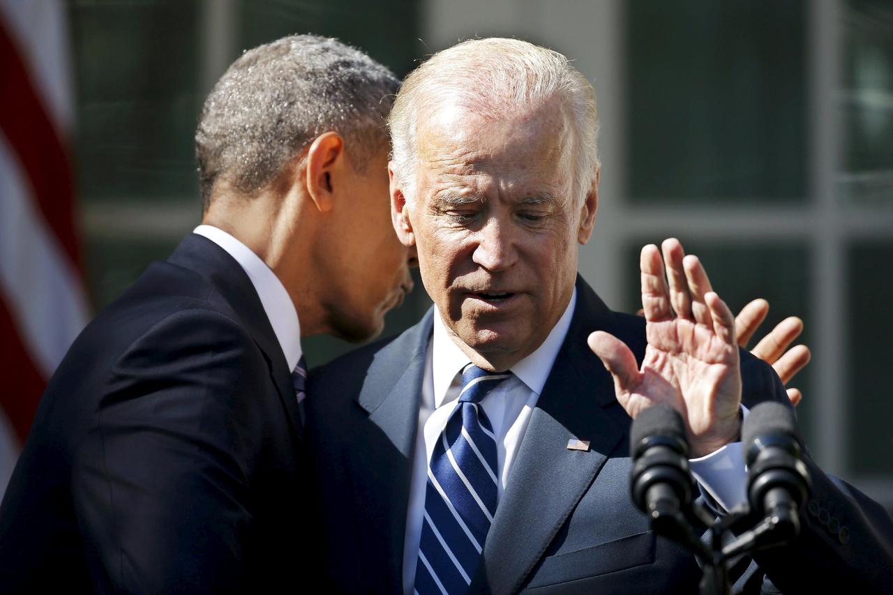 U.S. President Barack Obama hugs Vice President Joe Biden after Biden announced he will not seek the 2016 Democratic presidential nomination during an appearance in the Rose Garden of the White House in Washington October 21, 2015.