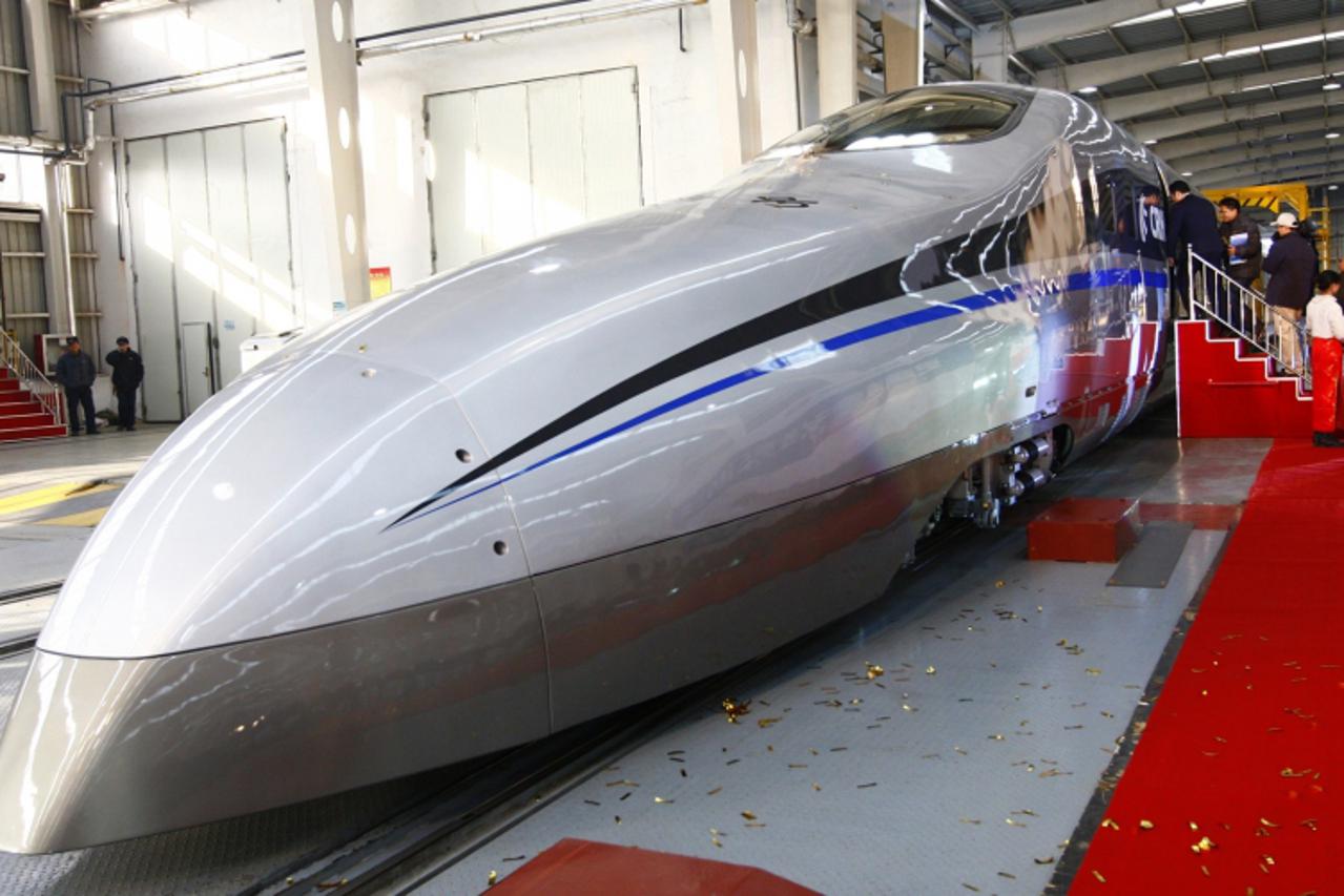 \'Visitors board a new testing model of a CSR high-speed bullet train during its launching ceremony in Qingdao, Shandong province December 23, 2011. China launched a super-rapid test train over the we