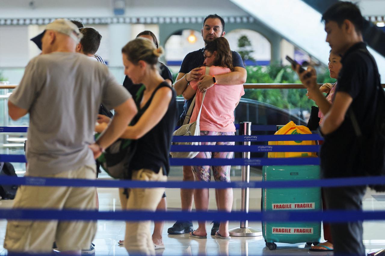 Stranded passengers at I Gusti Ngurah Rai International Airport after flights to Doha, Dubai, and Abu Dhabi were cancelled following strikes on Iran launched by the United States and Israel, in Kuta