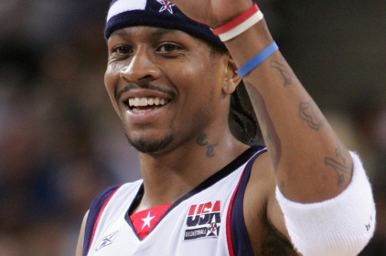 \'Allen Iverson of the U.S. celebrates an early point in their men\'s preliminary basketball game against Greece at the Athens 2004 Olympic Games August 17, 2004. The U.S. won the game 77-71.REUTERS/L