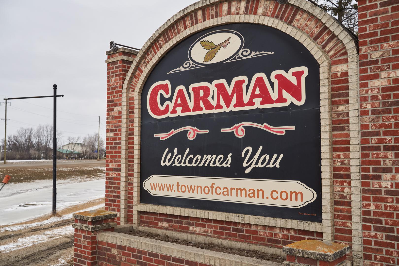 Carman, Manitoba sign. An ongoing investigation regarding five deaths in southern Manitoba continues, in Carman, Man., Monday, Feb. 12, 2024. THE CANADIAN PRESS/David Lipnowski