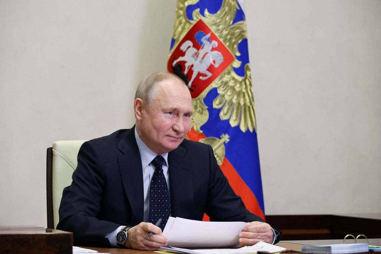 Russian President Vladimir Putin chairs a meeting with members of the government via video link at the Novo-Ogaryovo residence outside Moscow