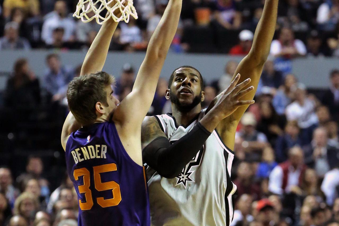 NBA: San Antonio Spurs vs Dallas Mavericks Jan 14, 2017; Mexico City, MEXICO; San Antonio Spurs forward LaMarcus Aldridge (12) shoots against the Phoenix Suns forward Dragan Bender (35) during the NBA game at the Mexico City Arena.  Mandatory Credit: Jos?