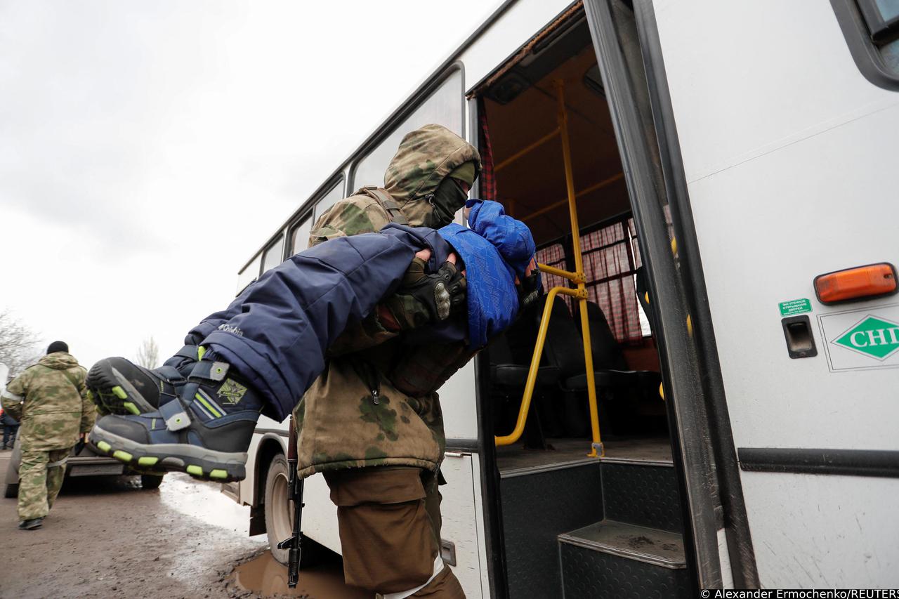 Evacuees from Mariupol area are seen at a camp in Bezymennoye