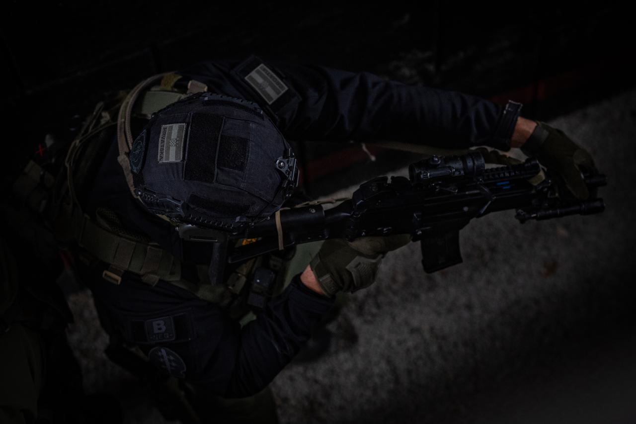 FILE PHOTO: Illustration shows 3D-printed miniature model of Elon Musk and Grok logo