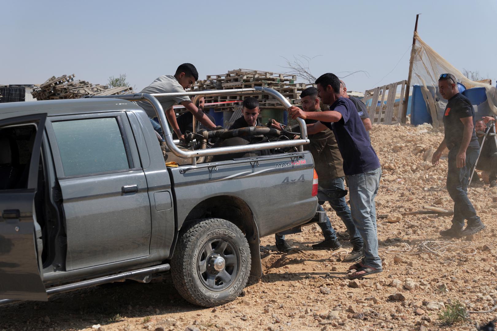 Residents transfer the remains of a rocket booster that, according to Israeli authorities critically injured a 7-year-old girl, after Iran launched drones and missiles towards Israel, onto a vehicle near Arad, Israel, April 14, 2024. REUTERS/Christophe van der Perre Photo: CHRISTOPHE VAN DER PERRE/REUTERS