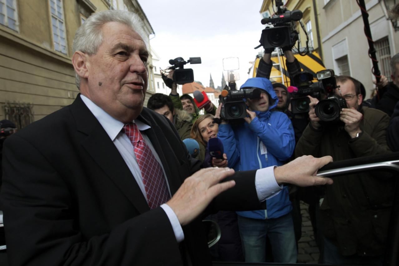 'Front-running Czech presidential candidate Milos Zeman arrives to his media venue in central Prague, to watch the results after polls closed, January 12, 2013. The first round of the country's direc