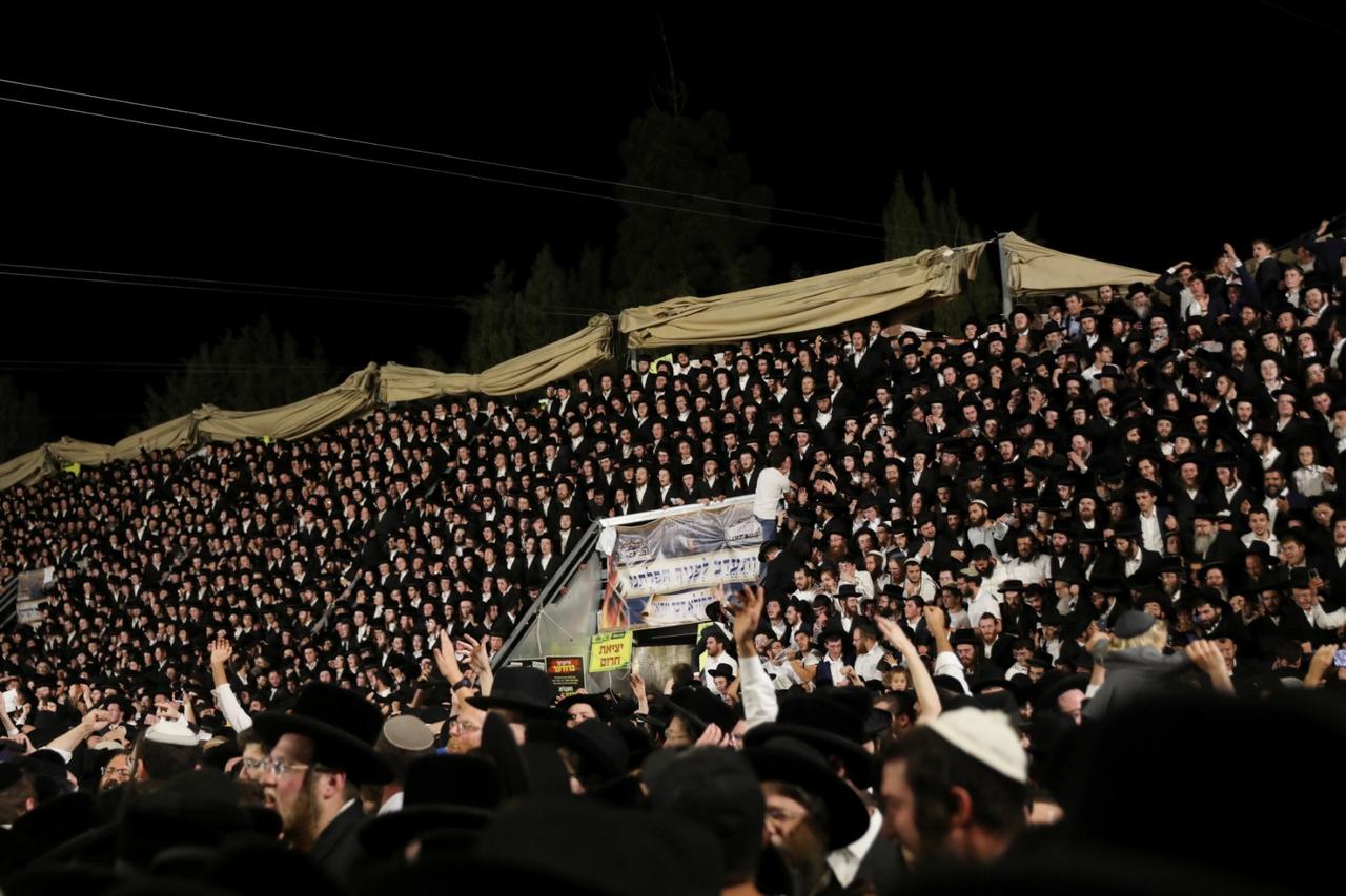 Jewish worshippers sing and dance at the Lag B'Omer event in Mount Meron, northern Israel