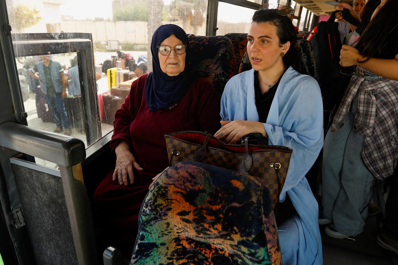 Suzan Besaiso, a Palestinian holding a U.S. passport, sits with her grandmother in a vehicle as she waits for permission to leave Gaza, amid the ongoing conflict between Israel and Palestinian Islamist group Hamas, at the Rafah border crossing with Egypt, in Rafah in the southern Gaza Strip, November 2, 2023. REUTERS/Ibraheem Abu Mustafa Photo: IBRAHEEM ABU MUSTAFA/REUTERS