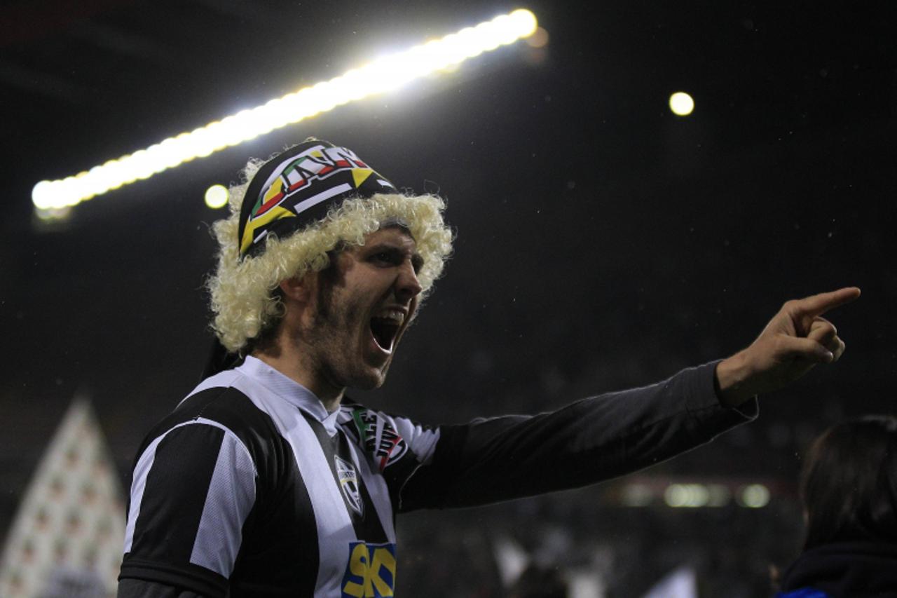 'A Juventus fan celebrates after the team won the Serie A title following their match against Cagliari at the Nereo Rocco stadium in Trieste May 6, 2012. Juventus won Serie A for the first time since 