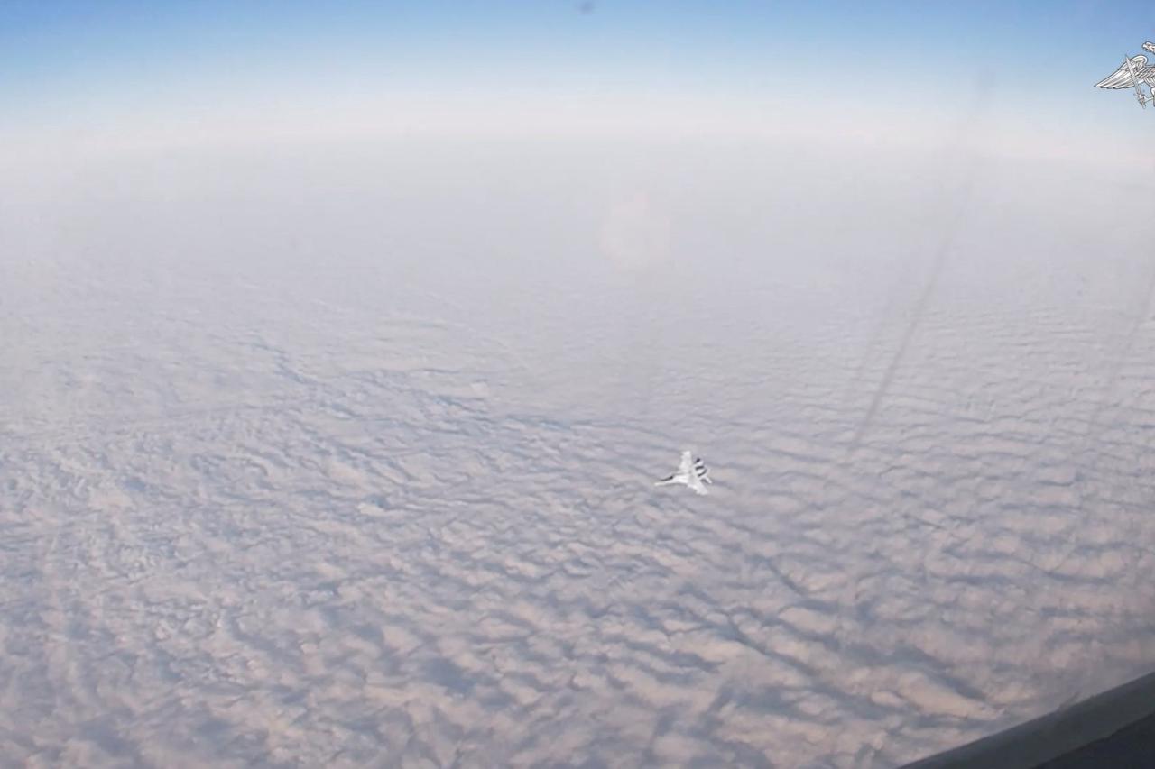 A Russian Tu-22M3 strategic bomber plane carries out a patrol over neutral waters of the Baltic Sea