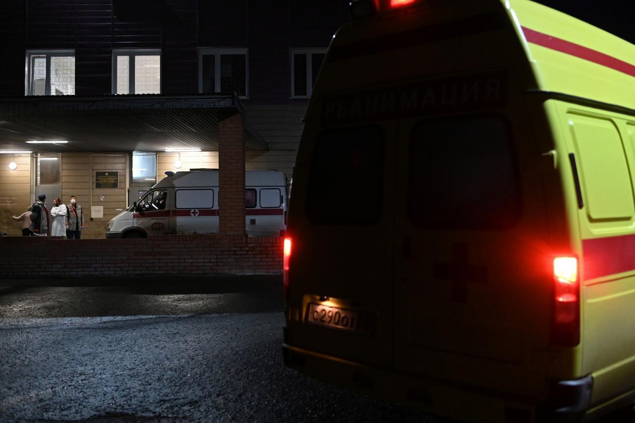 Ambulances and medical workers are seen outside a hospital where Russian opposition leader Navalny was admitted, in Omsk