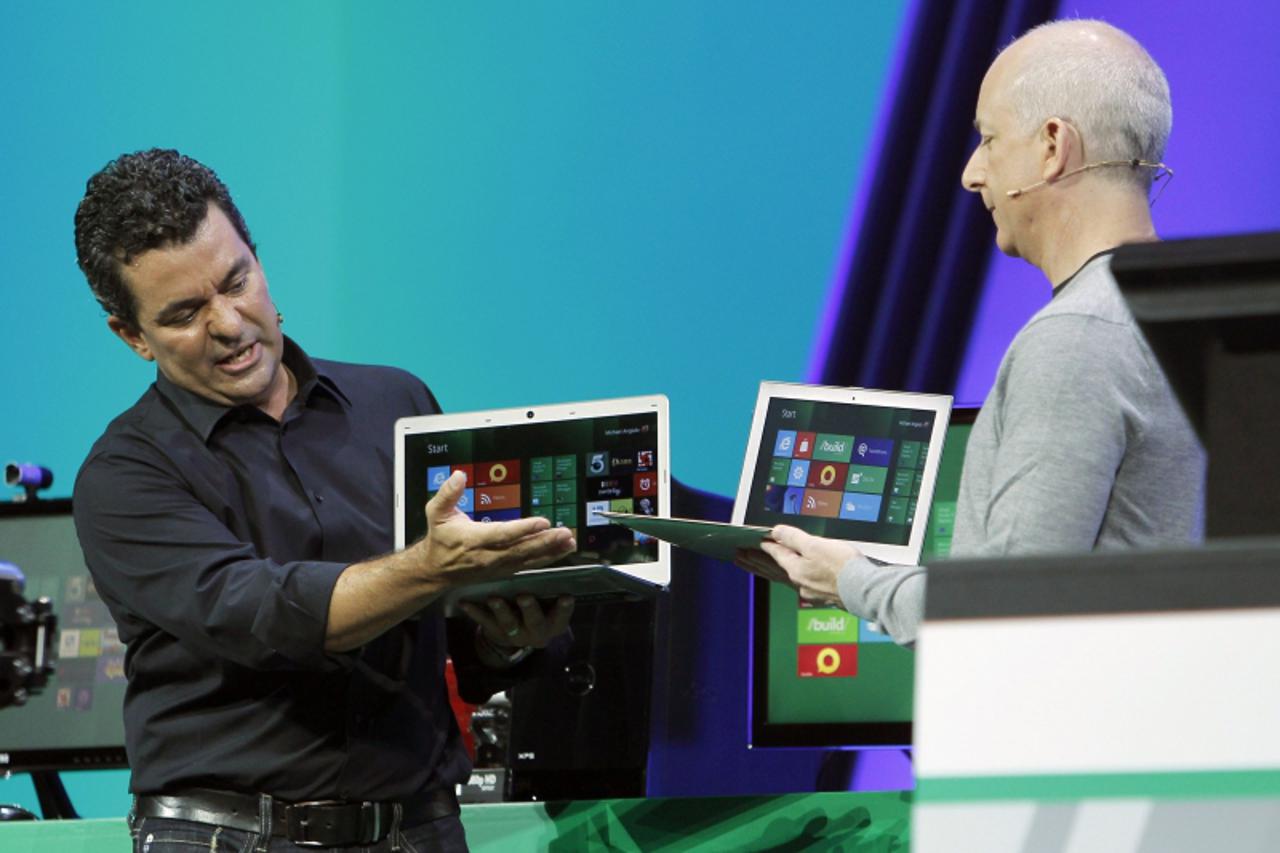 'Microsoft Windows President Steven Sinofsky (R) with Vice President Michael Angiulo introduce laptops in development that will run its touch-enabled Windows 8 at the Build conference in Anaheim, Cali