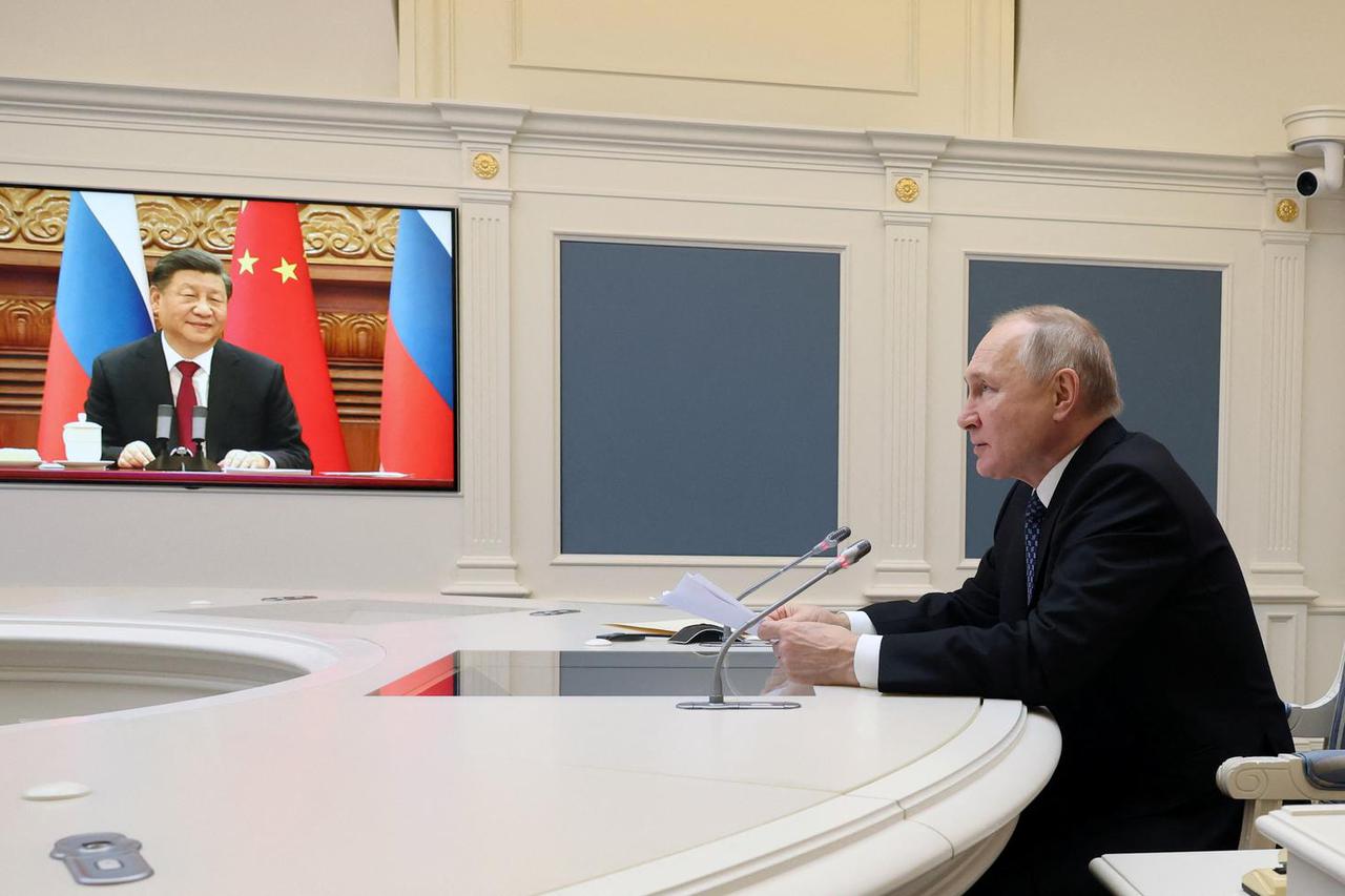Putin and Xi hold talks via videolink