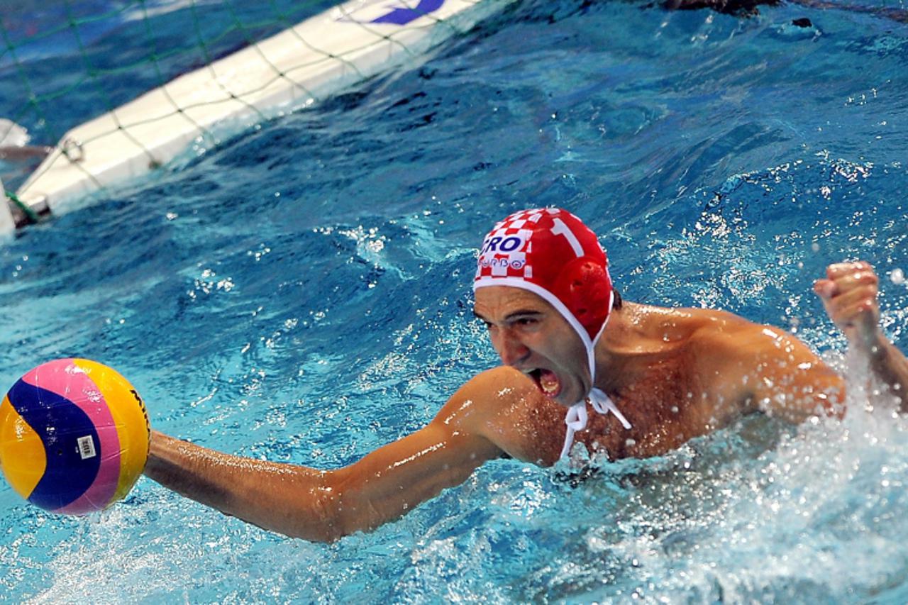 'Croatia\'s goalkeeper Josip Pavic celebrates the last seconds of the European Waterpolo Championships mens final match against Italy in Zagreb, on September 11, 2010. Croatia won 7-3 to win the champ