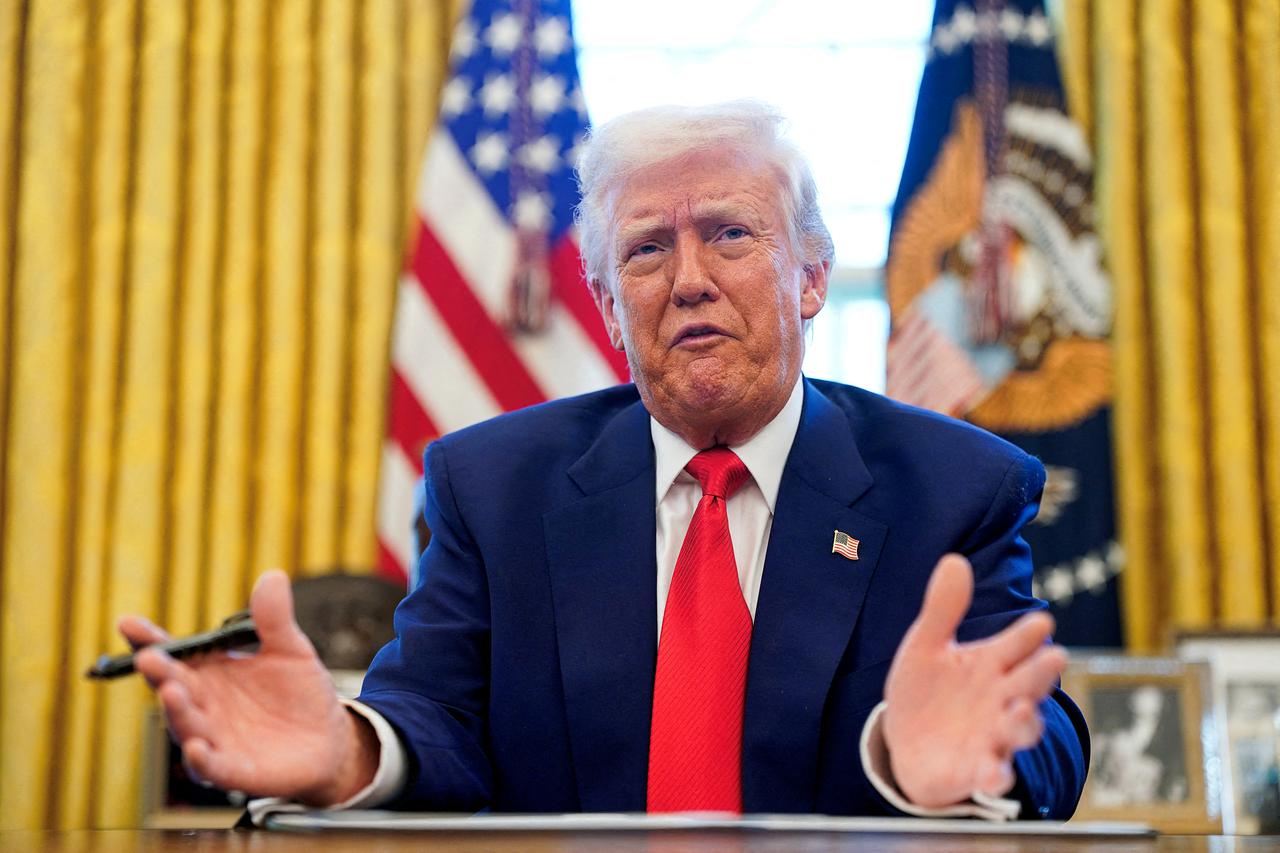 FILE PHOTO: U.S. President Donald Trump signs executive orders at the White House