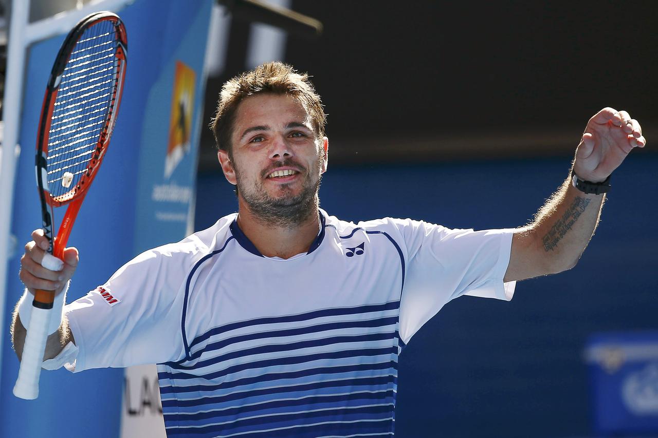 Stan Wawrinka of Switzerland celebrates defeating Kei Nishikori of Japan to win their men's singles quarter-final match at the Australian Open 2015 tennis tournament in Melbourne January 28, 2015.       REUTERS/Issei Kato (AUSTRALIA  - Tags: SPORT TENNIS)