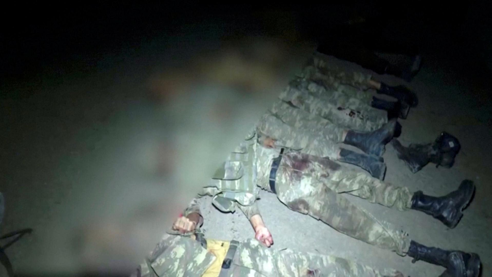 A still image from a handout video shows bodies of men in military uniform, who are said to be Azeri military personnel, in an unidentified location SENSITIVE MATERIAL. THIS IMAGE MAY OFFEND OR DISTURB    A still image from a video released by the army of the self-proclaimed Nagorno-Karabakh breakaway region shows bodies of men in military uniform, who are said to be Azeri military personnel, in an unidentified location, in this still image from footage released September 28, 2020. Picture blurred at source. Self-Proclaimed Artsakh Defence Army Handout/Reuters TV via REUTERS  ATTENTION EDITORS - THIS IMAGE HAS BEEN SUPPLIED BY A THIRD PARTY. NO RESALES. NO ARCHIVES. MANDATORY CREDIT. SELF-PROCLAIMED ARTSAKH DEFENCE