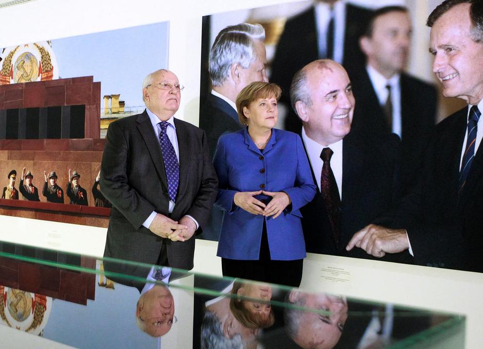 FILE PHOTO: German Chancellor Merkel and former Soviet leader Gobachev visit photo exhibition marking Gorbachev's 80th birthday at Kennedy museum in Berlin