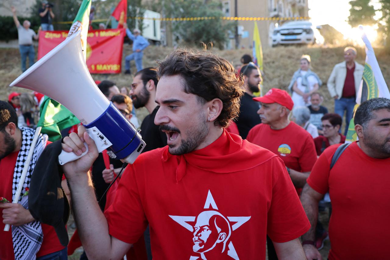 Left-wing Greek Cypriots and Turkish Cypriots take part in a rally to mark May Day in the United Nations Buffer Zone in Nicosia