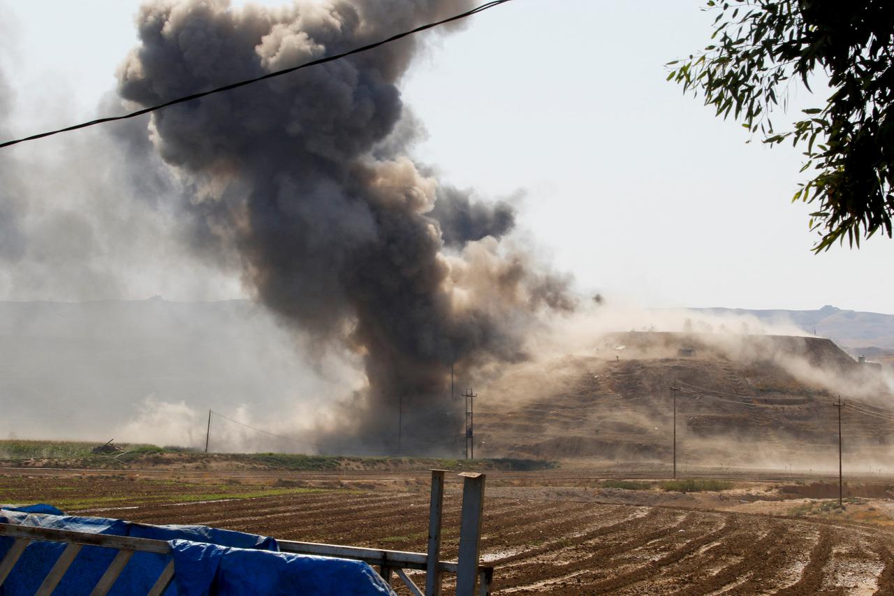 Smoke rises from headquarters of Kurdish Democratic Party of Iran, on the outskirts of Kirkuk