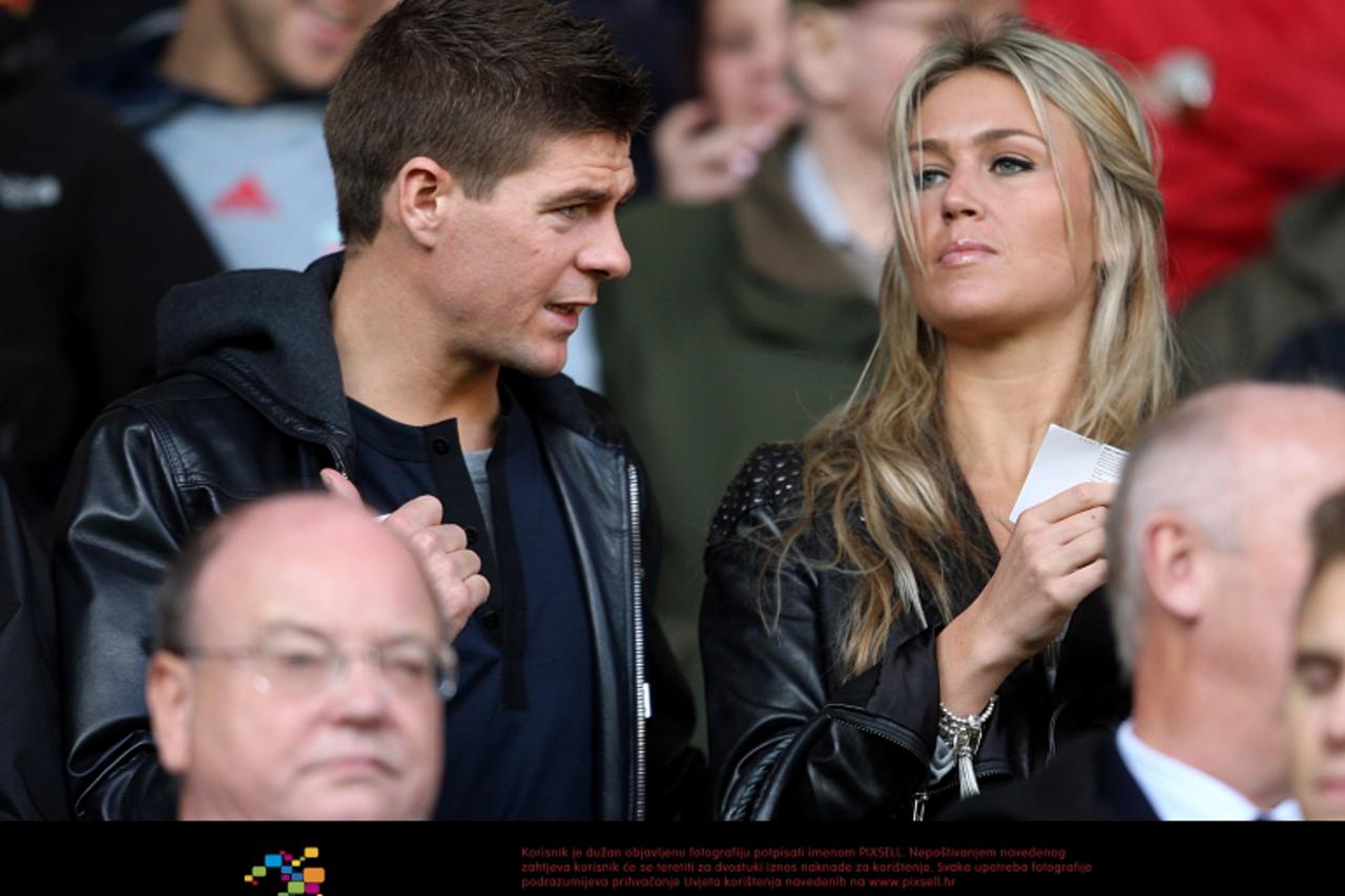 'Liverpool\'s Steven Gerrard (left) with wife Alex Curran in the stands Photo: Press Association/Pixsell'