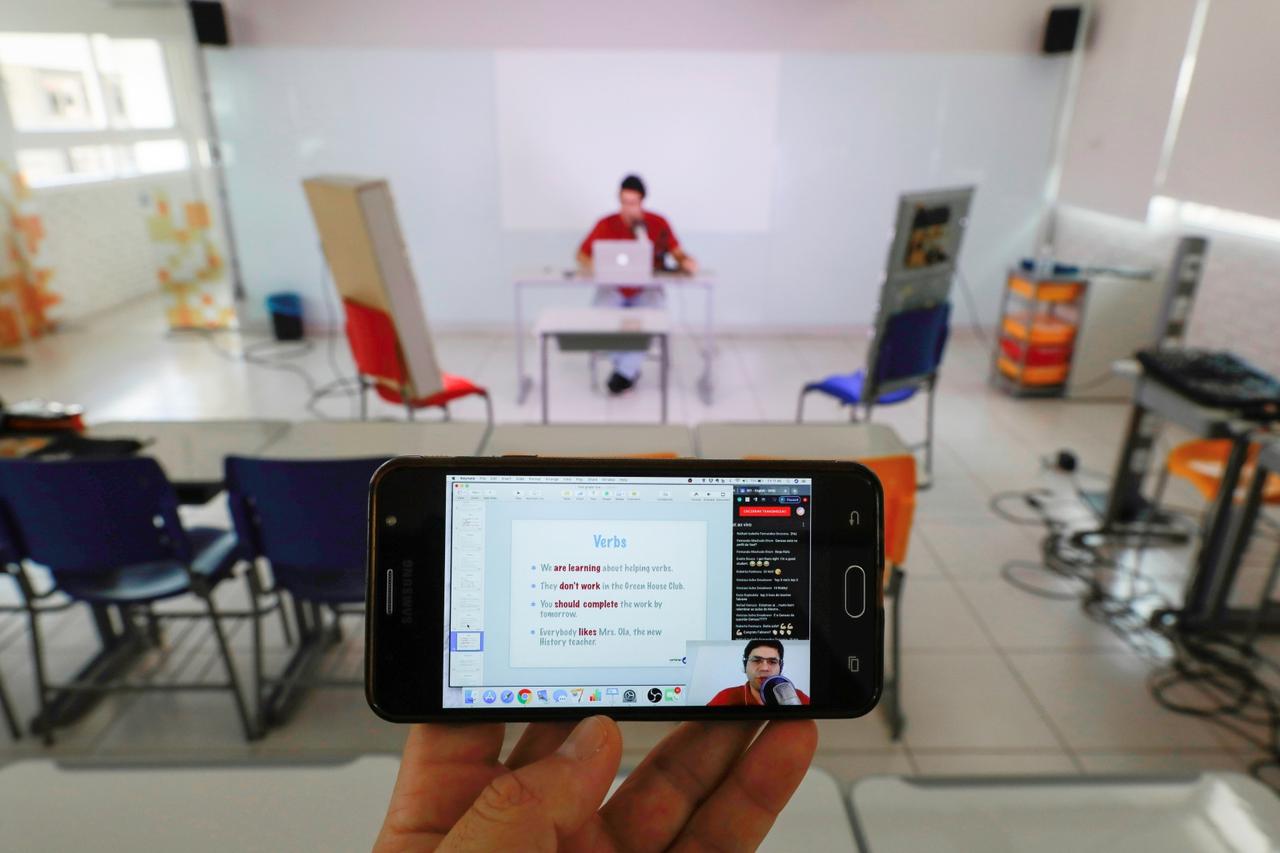 High school English teacher, Fabiano da Silva Silveira from the Colegio Israelita Brasileiro or Brazilian Israeli High School leads an online class after regular classes were suspended due to coronavirus disease (COVID-19) outbreak, in Porto Alegre