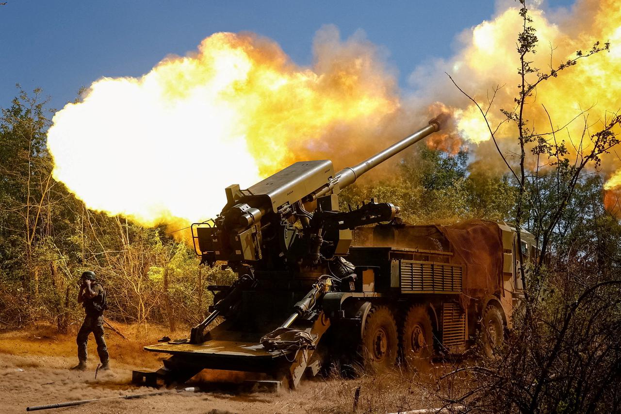 FILE PHOTO: A Ukrainian serviceman fires a self-propelled howitzer towards Russian troops in Zaporizhzhia region