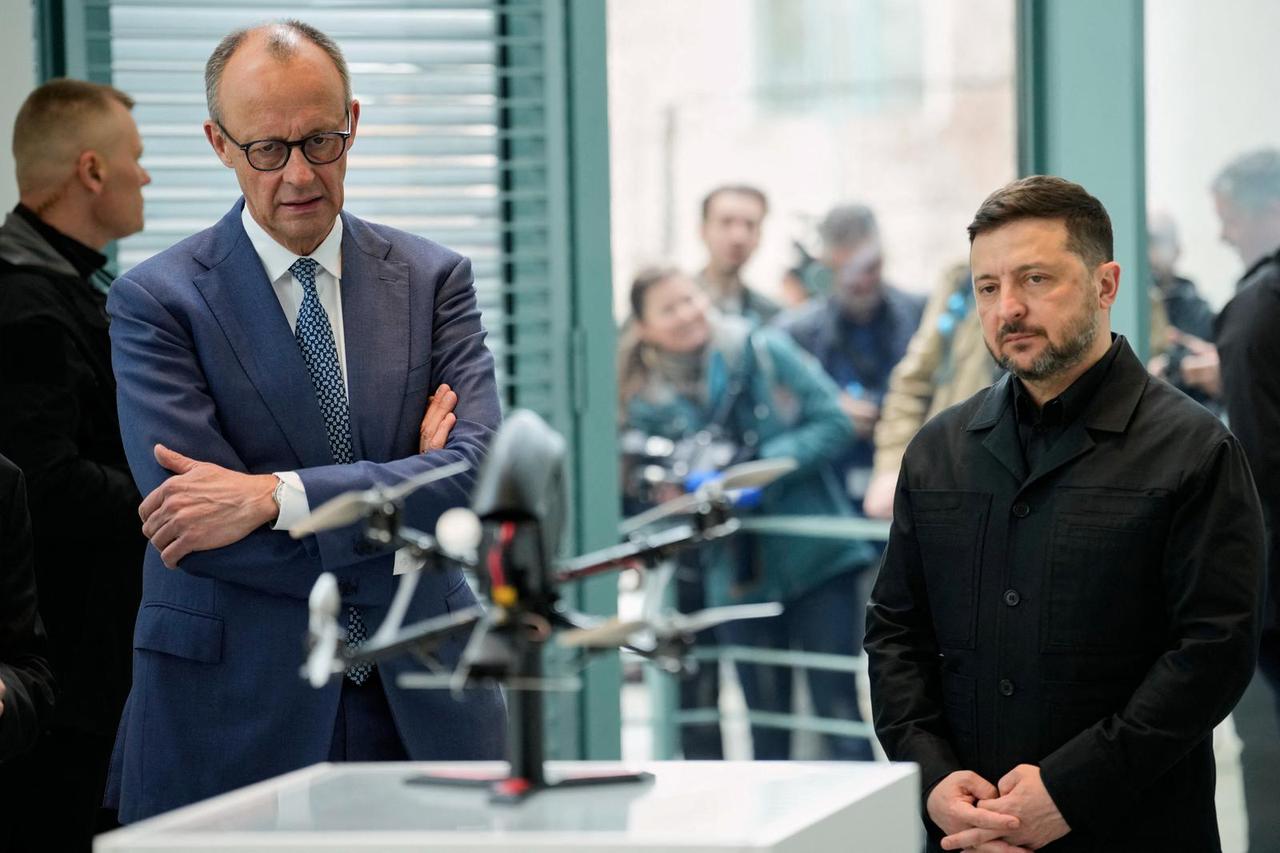 German Chancellor Friedrich Merz and Ukraine's President Volodymyr Zelenskyy watch a presentation of drones made in German-Ukrainian cooperation