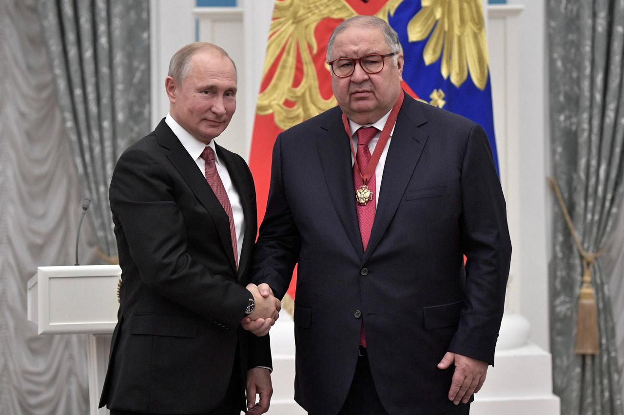 FILE PHOTO: Russian President Putin and Russian businessman Usmanov attend an awarding ceremony in Moscow