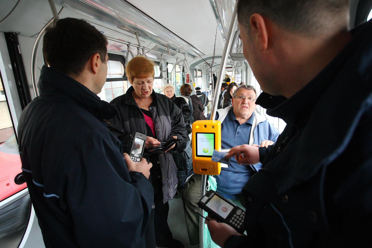 01.03.2012., Zagreb - Najbolji ZET-ovi kontrolori Dragutin Djurdjevic (42) i Davor Saric (35) u akciji provjere karata na prvi dan skupljih cijena javnog prijevoza u Zagrebu.  Photo: Tomislav Miletic/PIXSELL