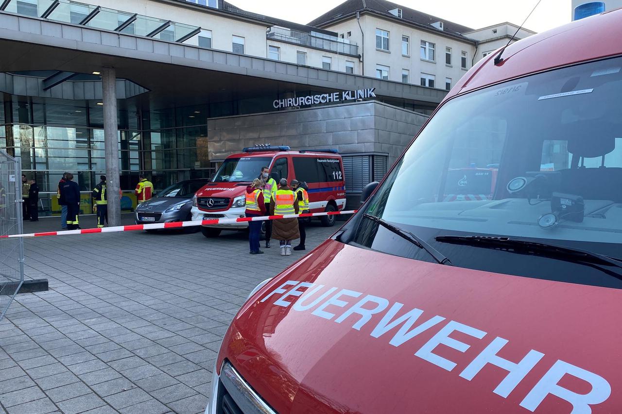 Police and firefighters secure the area at the premises of the Heidelberg university