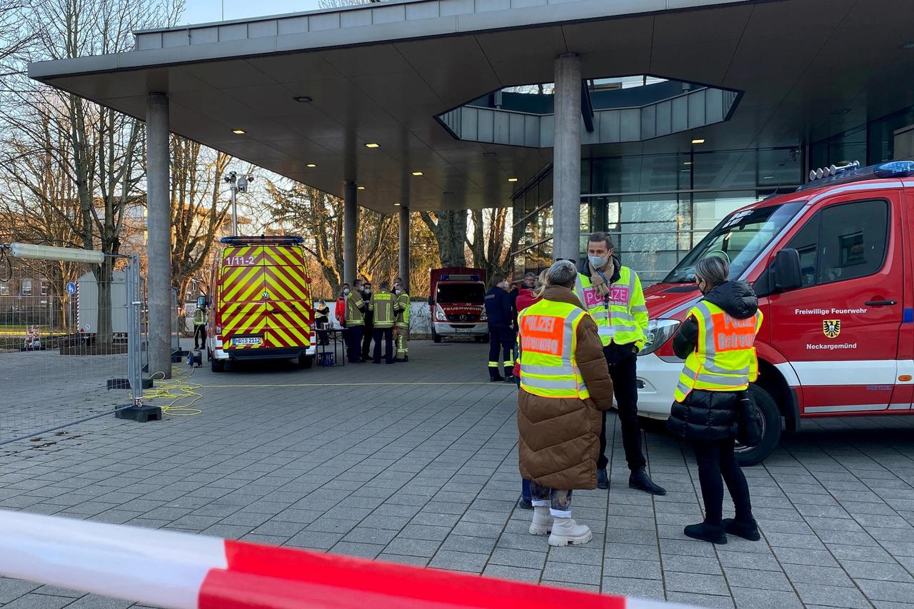 Police and firefighters secure the area at the premises of the Heidelberg university