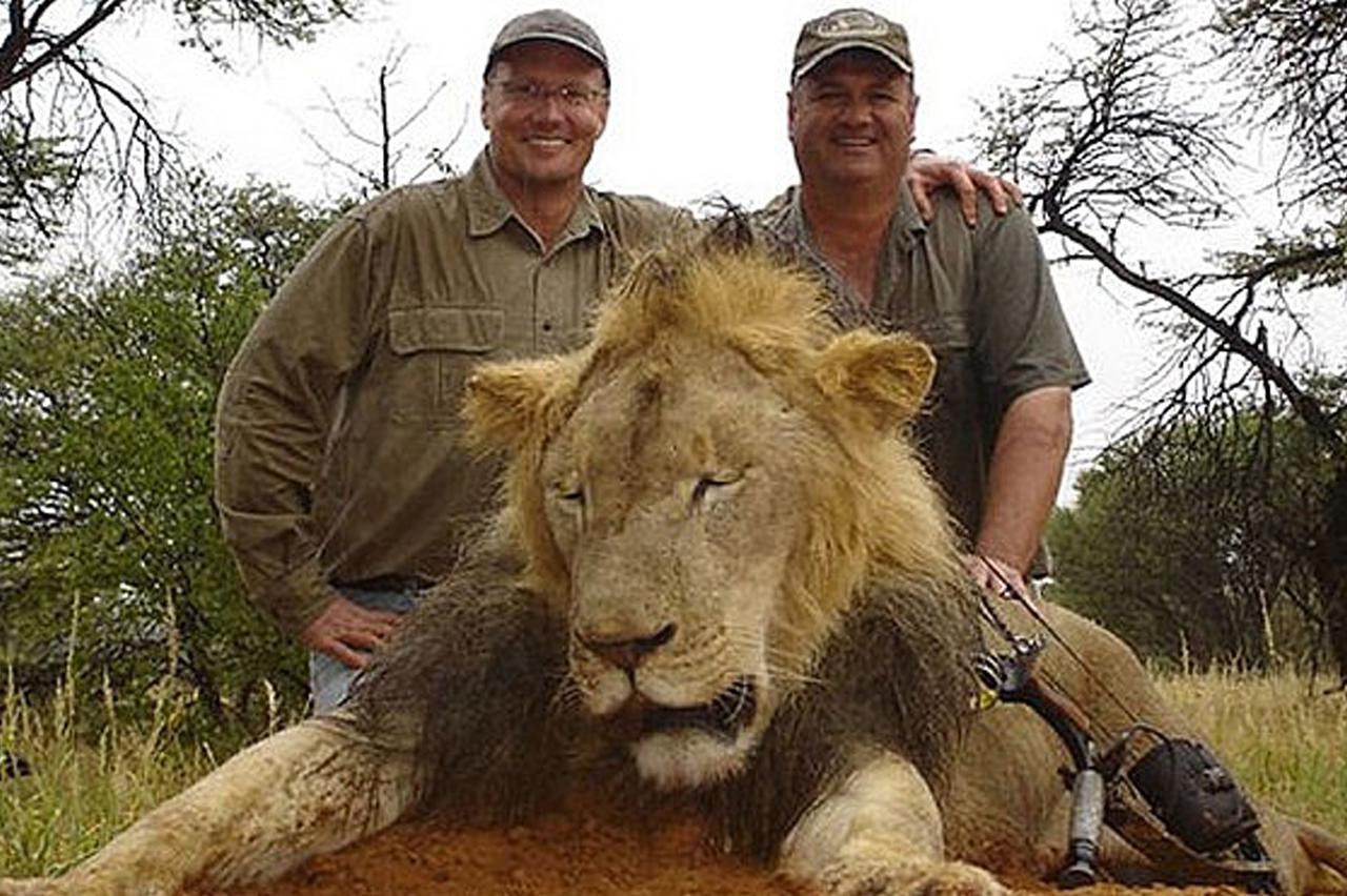 Walter J. Palmer (left) with one of his trophies. (man at right is unidentified) photo: facebook.