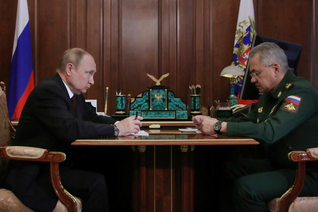 Russian President Vladimir Putin meets with Defence Minister Sergei Shoigu in Moscow