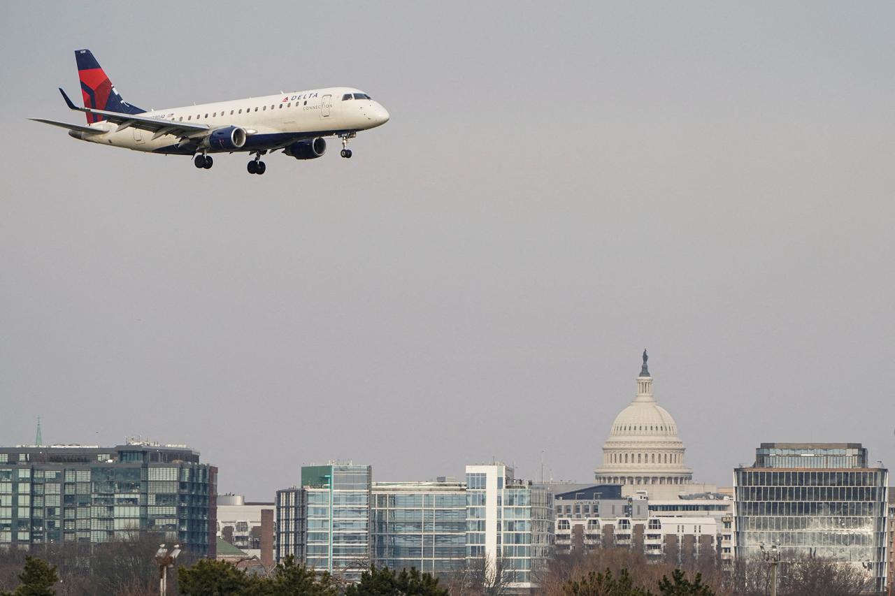 FILE PHOTO: A Delta Air Lines aircraft lands at Reagan National Airport in Arlington, Virginia