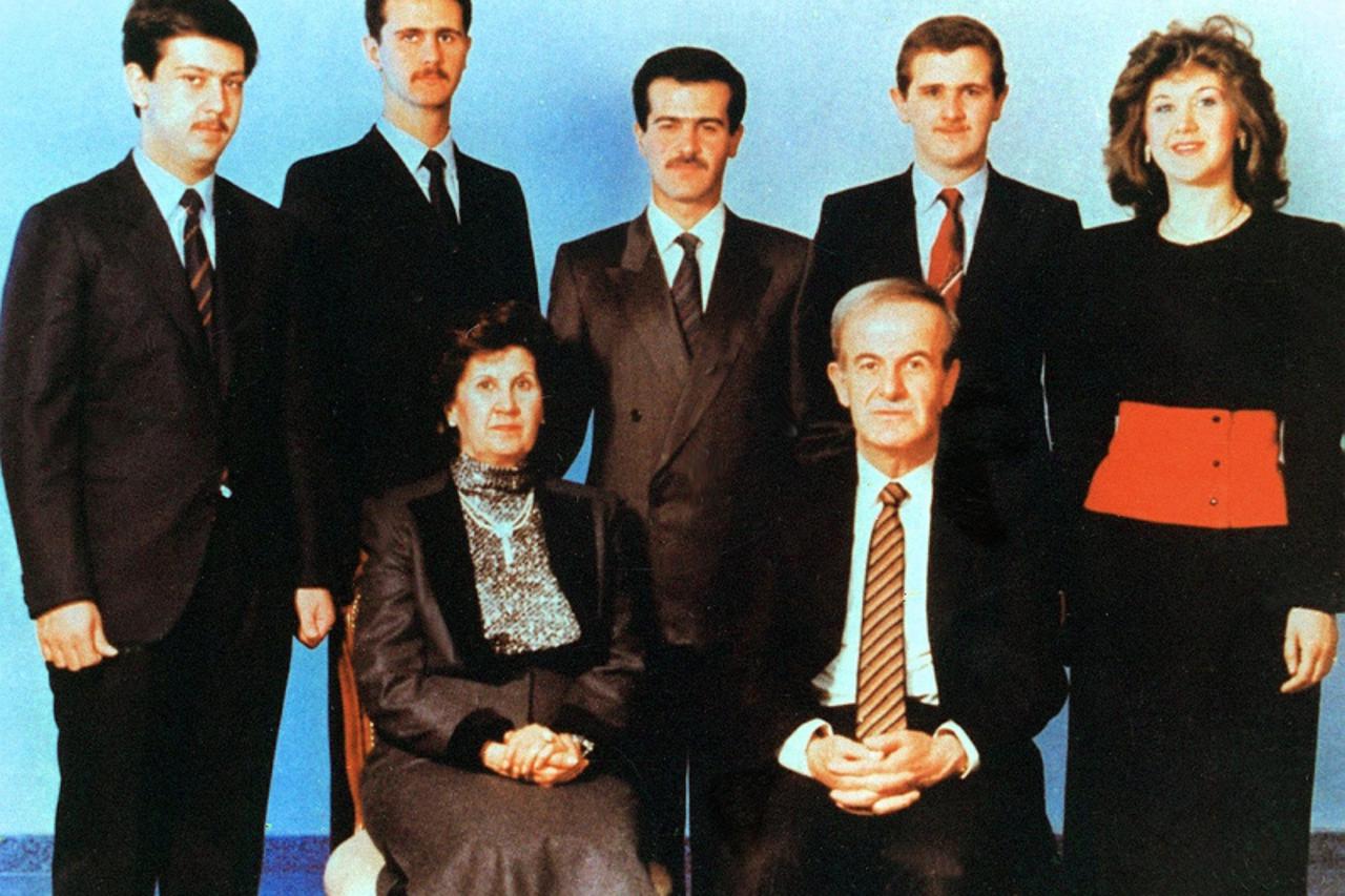 'Undated picture shows Syrian President Hafez al-Assad and his wife Anisseh posing for a family picture with his children (L to R) Maher, Bashar, Bassel, who died in a car accident in 1994, Majd and B