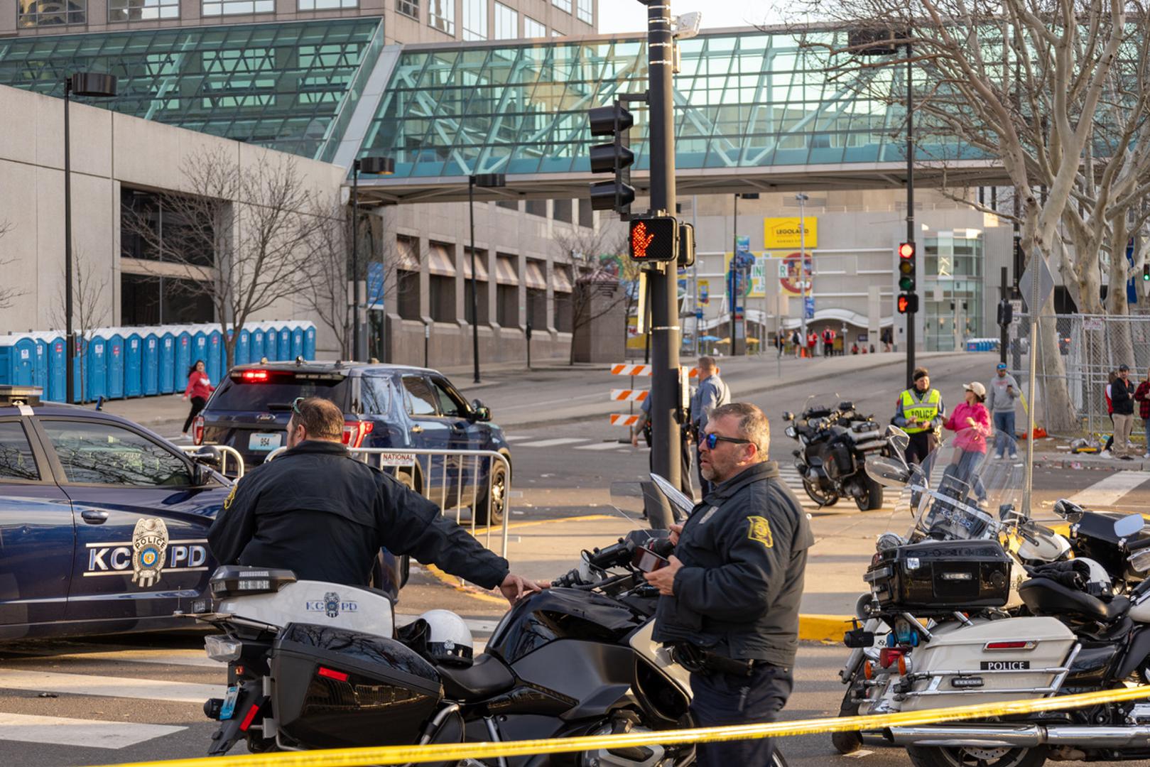(240215) -- KANSAS CITY, Feb. 15, 2024 (Xinhua) -- Policemen work at the site following a shooting in Kansas City, Missouri, the United States, Feb. 14, 2024. At least one person was killed and 22 were injured as gunfire erupted during the Kansas City Chiefs' Super Bowl victory parade in Kansas City, U.S. state of Missouri, Stacey Graves, chief of the Kansas City Missouri Police Department, said at a news conference on Wednesday afternoon. (Photo by Robert Reed/Xinhua) Photo: Robert Reed/XINHUA