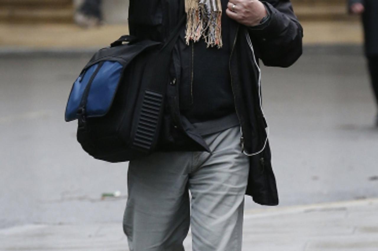 'Lawyer Giovanni Di Stefano arrives at Southwark Crown Court in London January 29, 2013.                 REUTERS/Suzanne Plunkett (BRITAIN - Tags: CRIME LAW SOCIETY)'