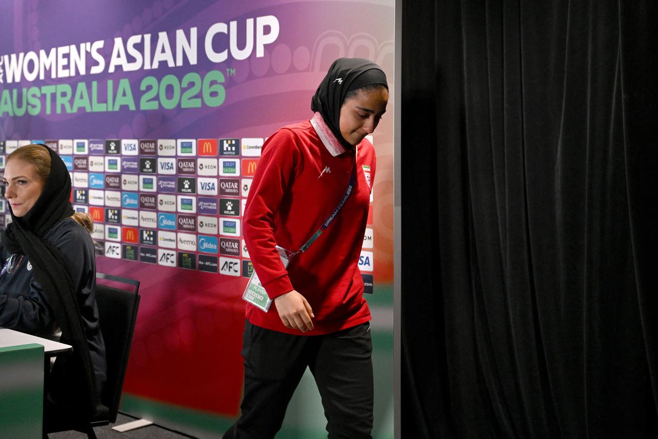 Sara Didar reacts as she departs the Women's Asian Cup Iran team press conference at the Gold Coast Stadium