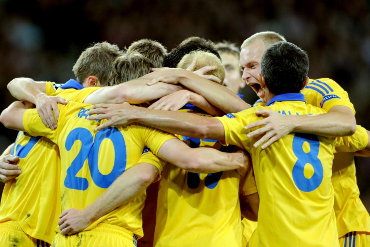 'Bate Borisov\'s belarus forward  Vitali Rodionov celebrates with teammates after scoring during the UEFA Champions League football match Lille vs Bate Borisov on september 19, 2012 at the Grand stade