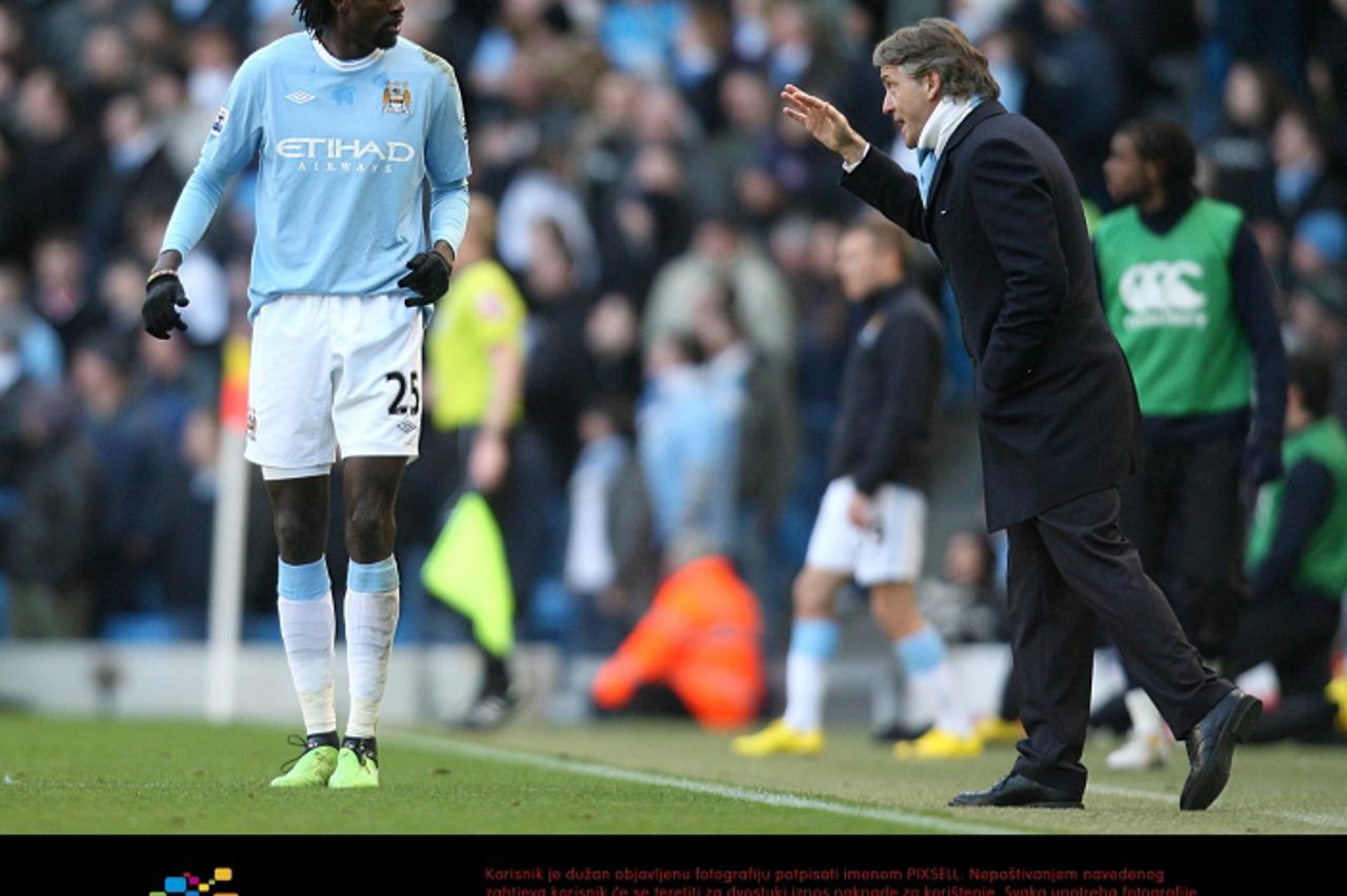 'Manchester City manager Roberto Mancini gives instructions to Emmanuel Adebayor Photo: Press Association/Pixsell'