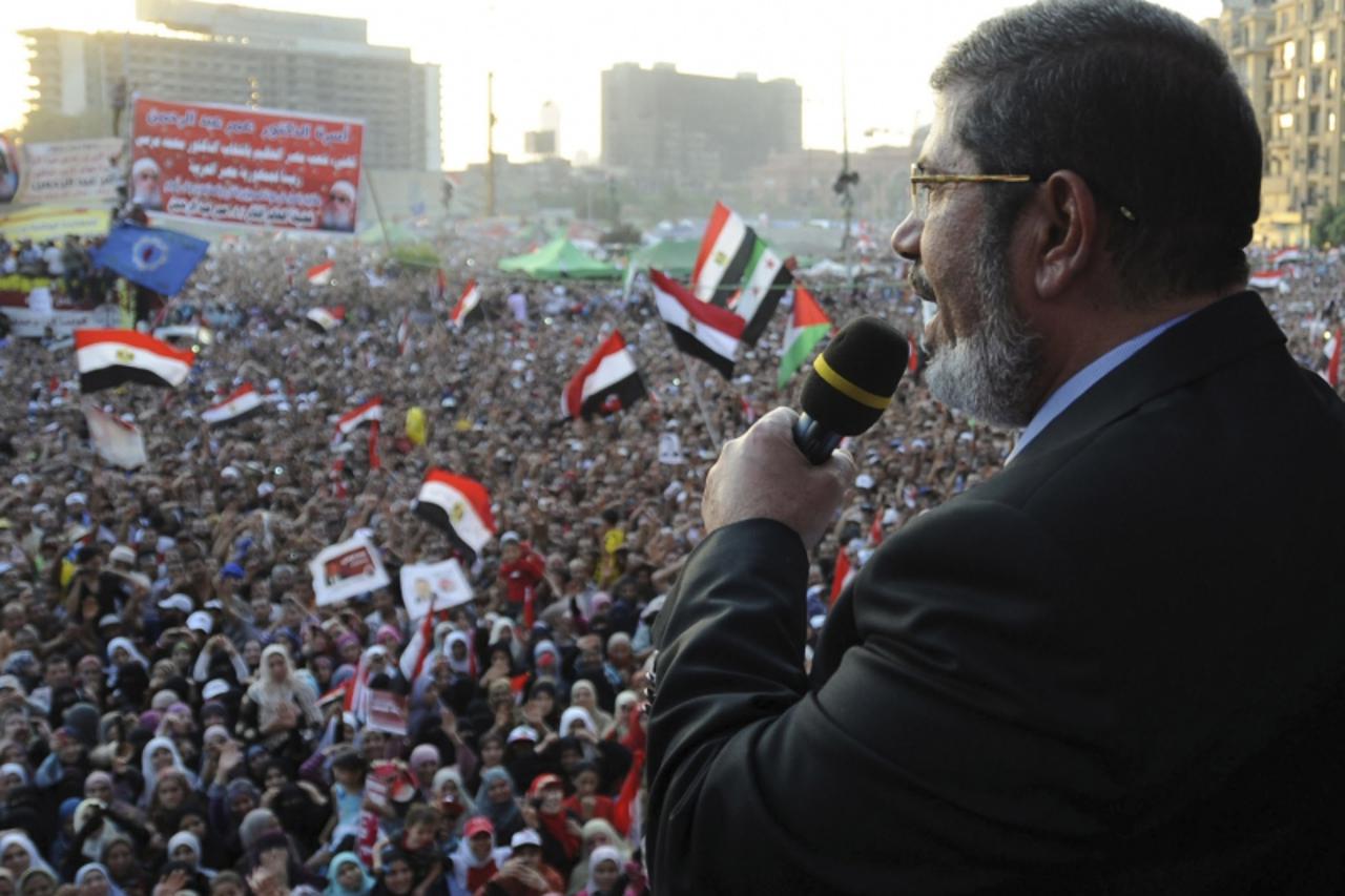 'Egypt\'s Islamist President-elect Mohamed Mursi delivers a speech in Cairo\'s Tahrir Square June 29, 2012. Mursi took an informal oath of office on Friday before tens of thousands of supporters in Ca