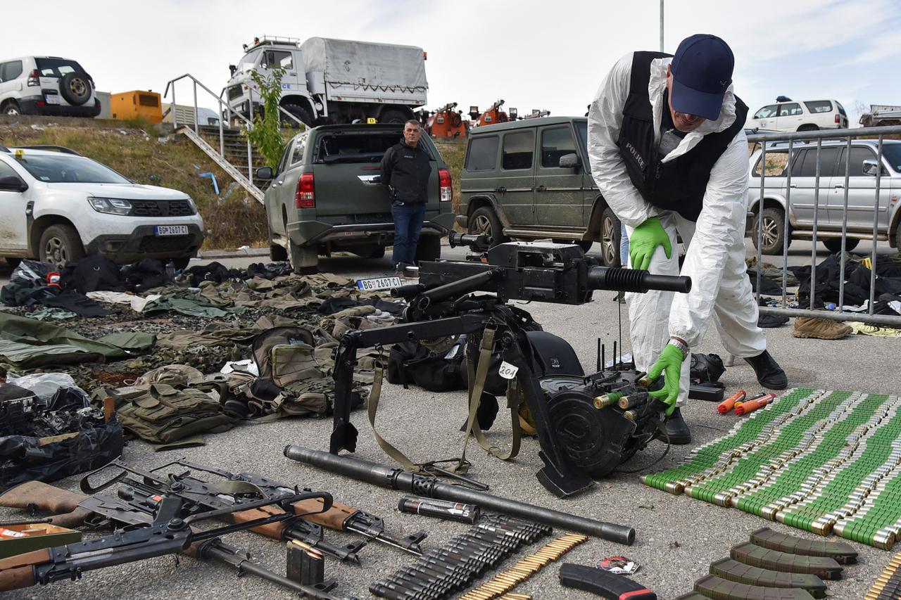 Kosovo police display weapons and military equipment, seized during the police operation, near Mitrovica