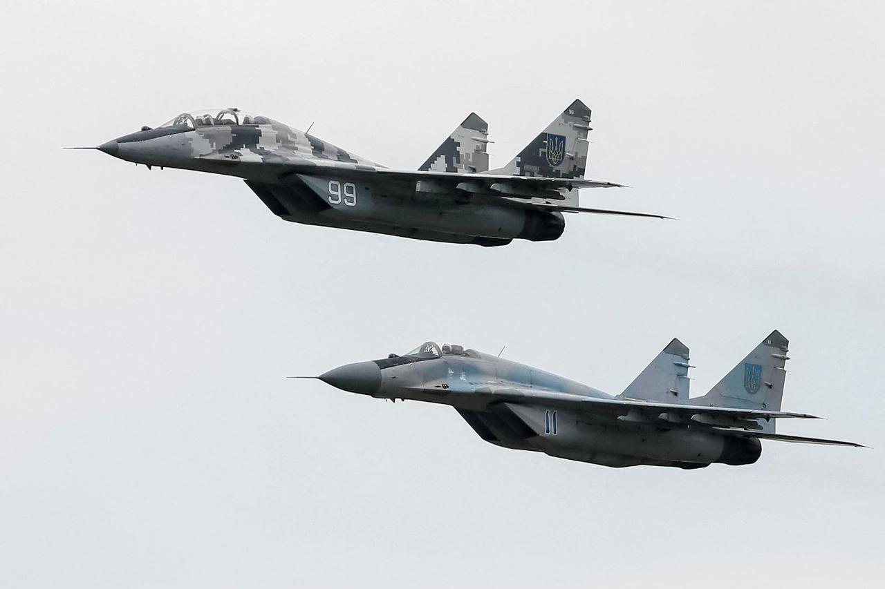 FILE PHOTO: MIG-29 fighter aircrafts fly at a military air base in Vasylkiv