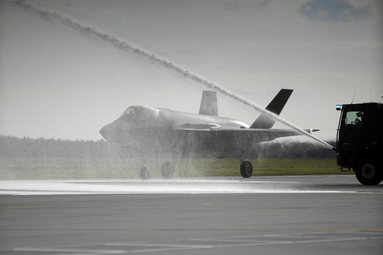 Newly delivered Polish Air Force F-35A Lightning II “Husarz” fighter jet, one of the first three aircraft purchased by Poland, receives a water salute at the 32nd Tactical Air Base in Lask