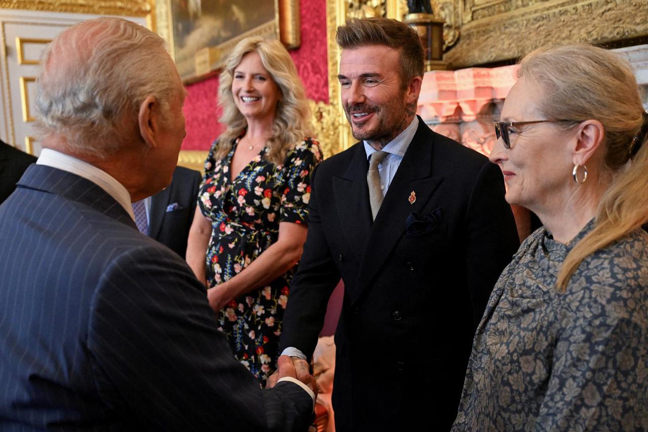 FILE PHOTO: David Beckham shakes hands with Britain's King Charles