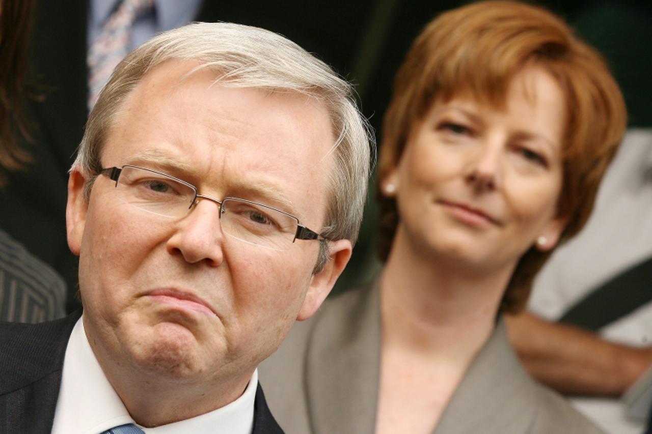 '(FILES) New Labour leader Kevin Rudd (L) and his deputy Julia Gillard (R) speak to the media at a doorstop, in Melbourne  December 13 2006.  Australia\'s Julia Gillard became the country\'s first fem