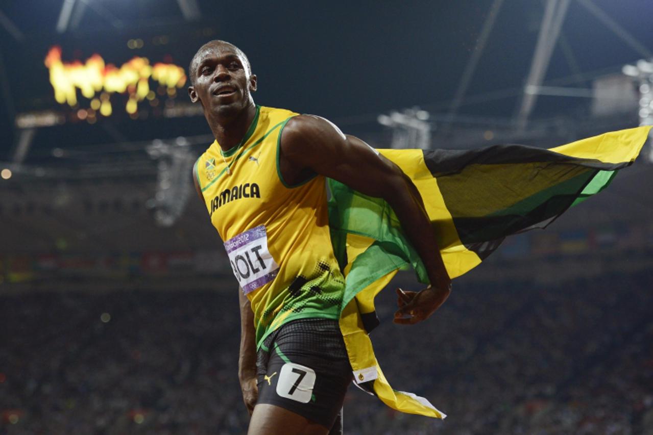 'Jamaica\'s Usain Bolt celebrates after he won the men\'s 200m final during the London 2012 Olympic Games at the Olympic Stadium in this August 9, 2012 file photo.    The world\'s fastest man and his 
