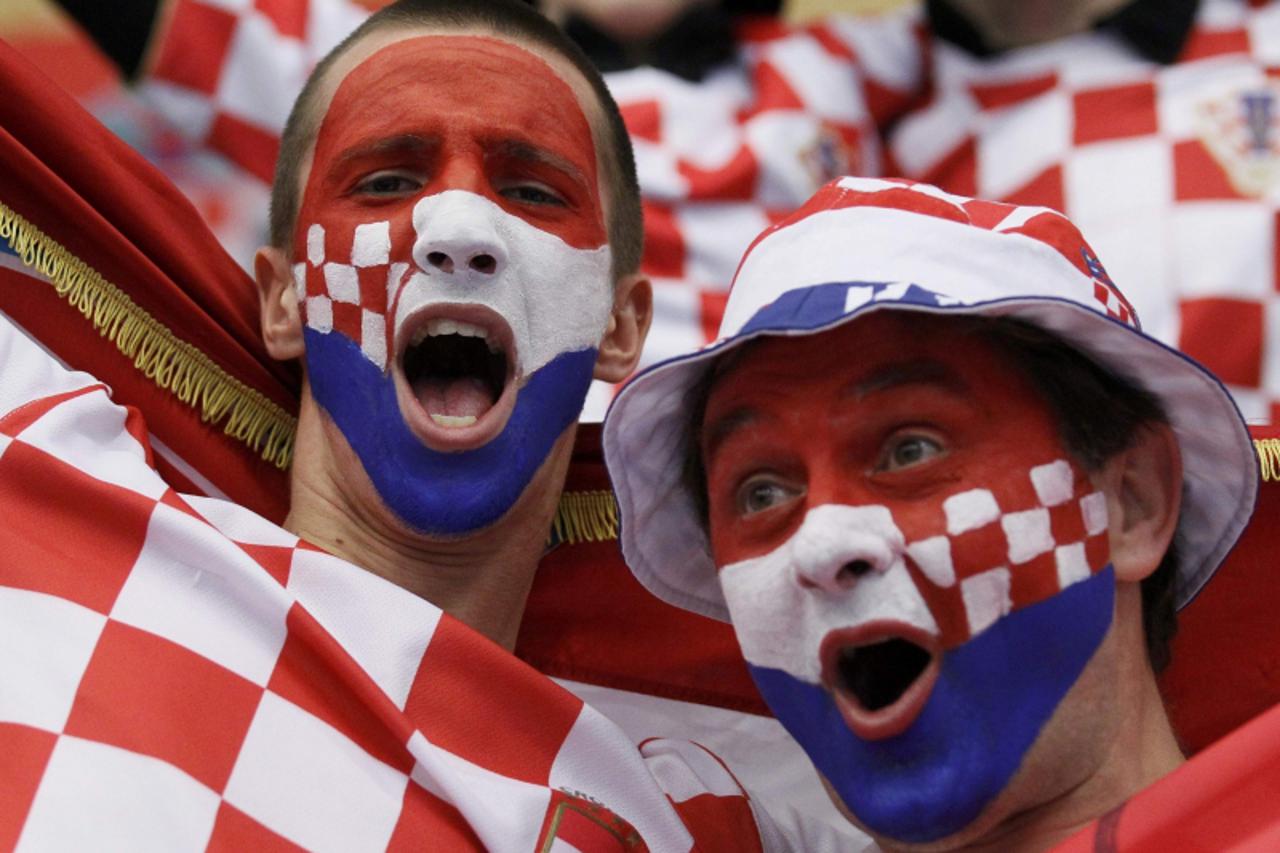 'Supporters from Croatia cheer their team before the game against Algeria at the Men\'s Handball World Championship  in Lund January 16, 2011.     REUTERS/Yves Herman (SWEDEN  - Tags: SPORT HANDBALL) 